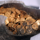 The gold coins found in the soapstone jar.